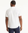 Model wearing an UNTUCKit Bright White Wrinkle-Resistant Linen Short-Sleeve Cameron Shirt