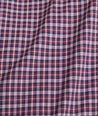 Model is wearing UNTUCKit performance Delune shirt in red. 