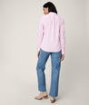 Model is wearing UNTUCKit Bella shirt in pink.