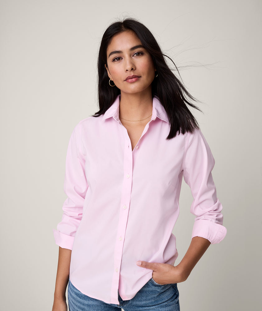 Model is wearing UNTUCKit Bella shirt in pink.