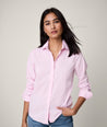 Model is wearing UNTUCKit Bella shirt in pink.