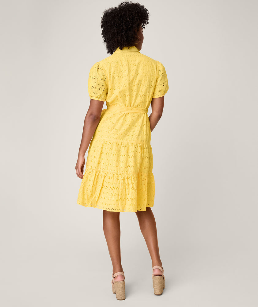 Model is wearing UNTUCKit solid Yellow Augusta Dress.