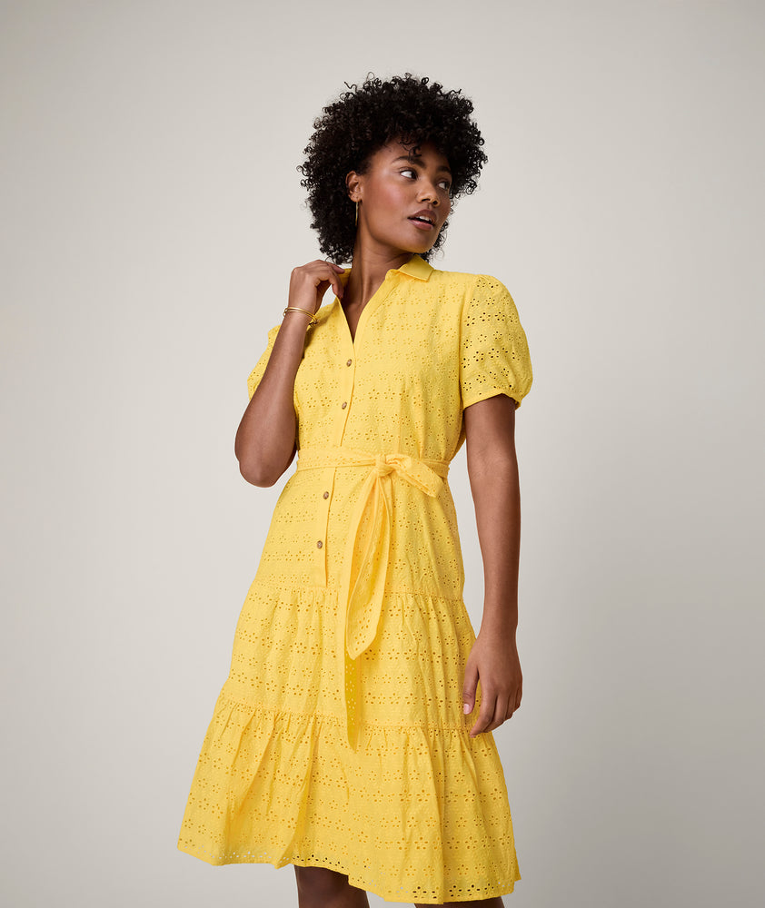 Model is wearing UNTUCKit solid Yellow Augusta Dress.