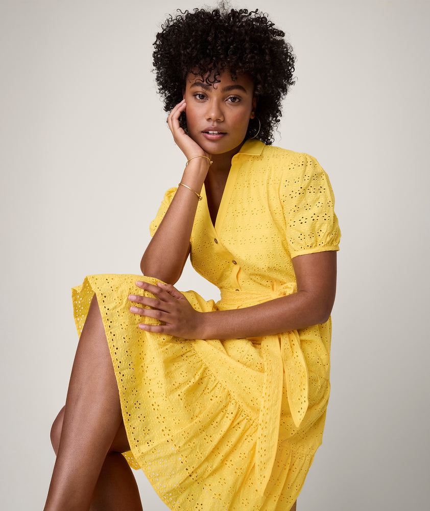 Model is wearing UNTUCKit solid Yellow Augusta Dress.