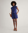 Model is wearing UNTUCKit Cotton Poplin Ada Short in navy. 