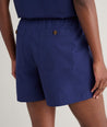 Model is wearing UNTUCKit Cotton Poplin Ada Short in navy. 