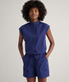 Model is wearing UNTUCKit Cotton Poplin Ada Short in navy. 