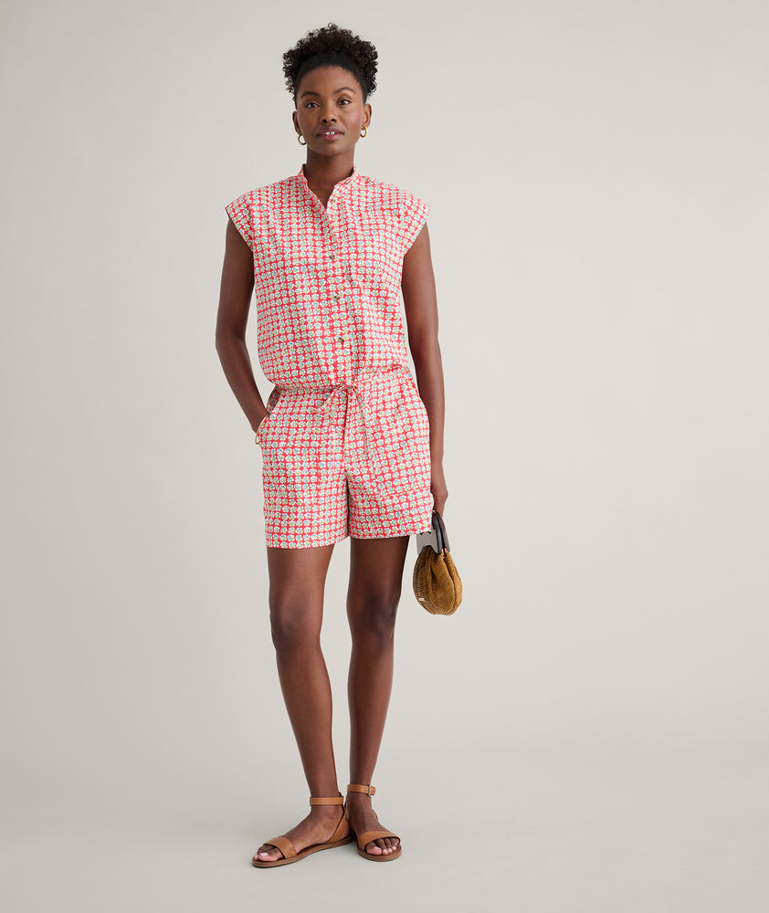 Model is wearing UNTUCKit Ada short in red. 