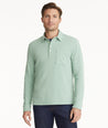 Model is wearing UNTUCKit Agrill Heavyweight Polo in Granite Green.