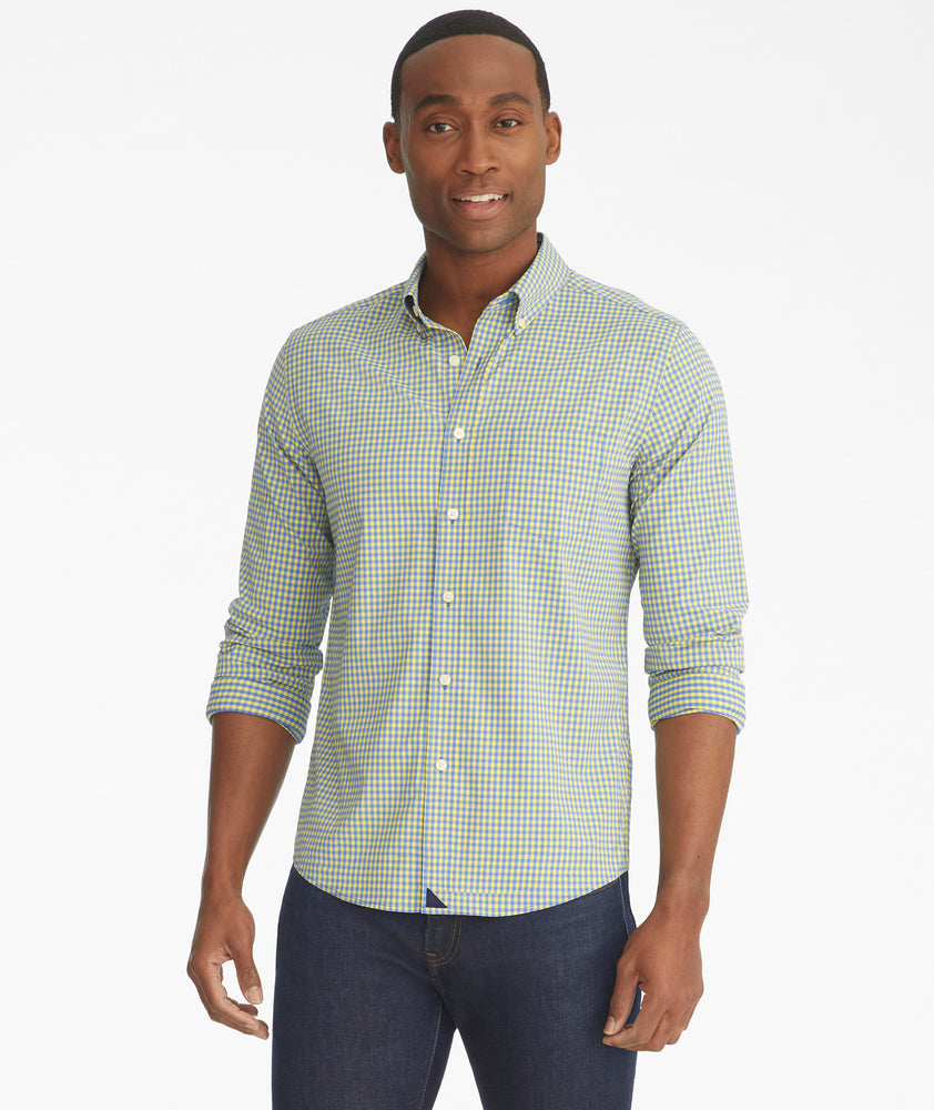 Model is wearing UNTUCKit albarei gingham shirt.