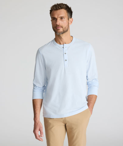 Model is wearing UNTUCKit Ultrasoft Henley in light blue. 
