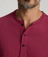 Model is wearing UNTUCKit Albarino Henley in Rhododrendron.