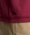 Model is wearing UNTUCKit Albarino Henley in Rhododrendron.