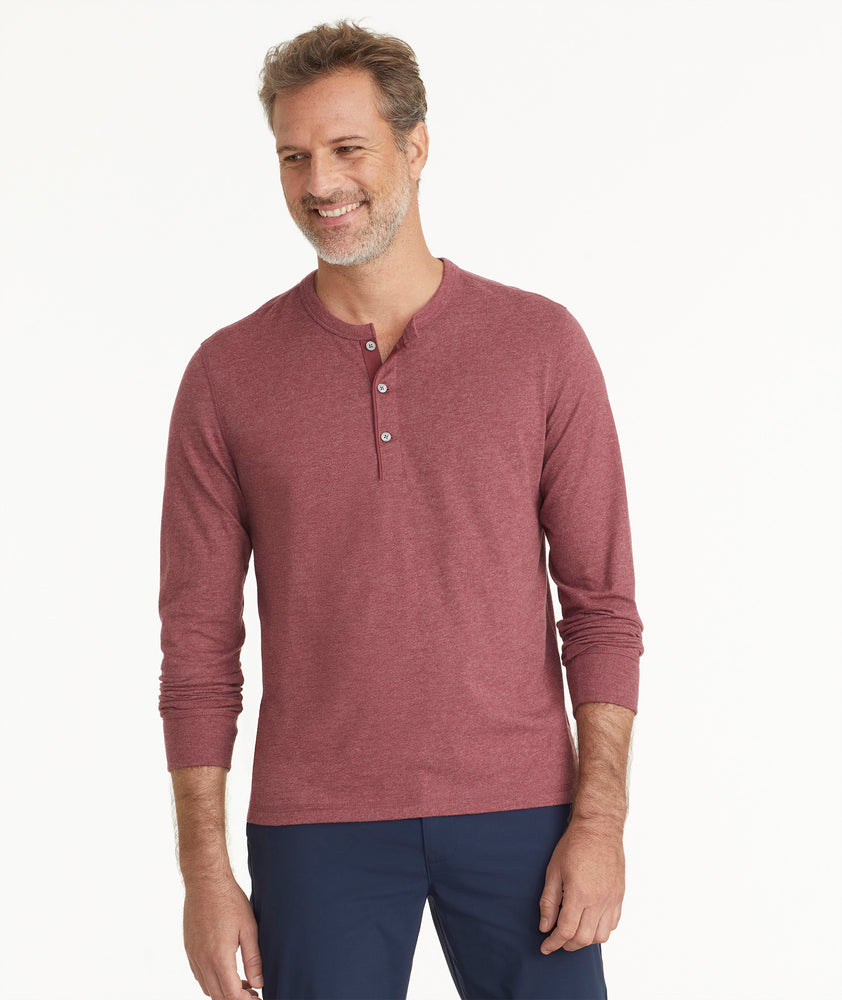 Model is wearing UNTUCKit Ultrasoft Long-Sleeve Henley in deep red.