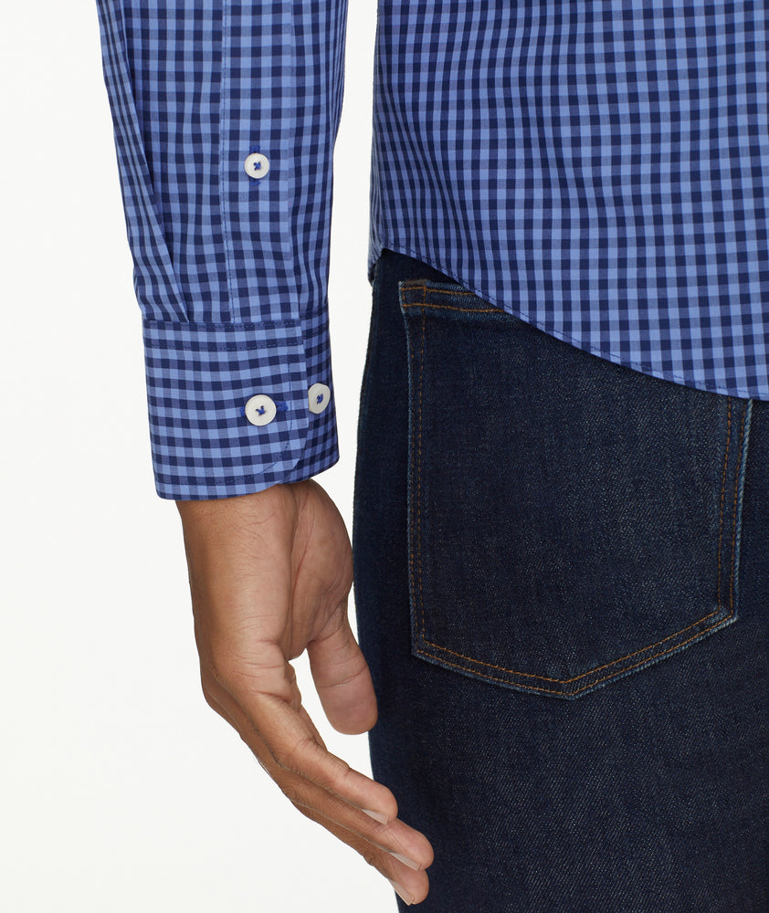 Model is wearing UNTUCKit Wrinkle-Free Alberdi Shirt in Blue & Navy Gingham
