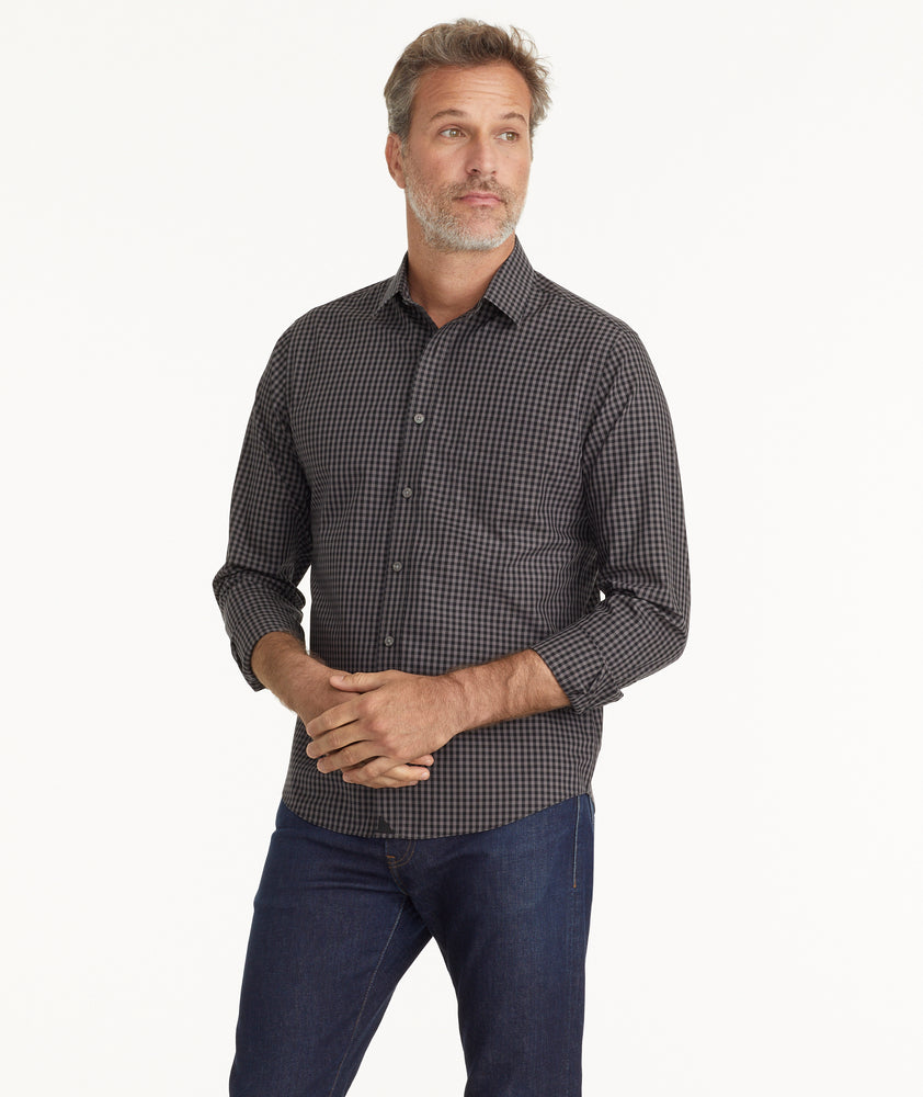 Model is wearing UNTUCKit Wrinkle-Free Alberdi Shirt in Gray & Black Gingham.