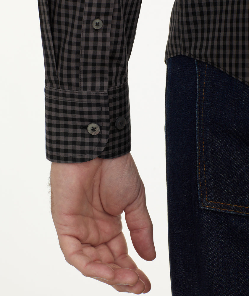 Model is wearing UNTUCKit Wrinkle-Free Alberdi Shirt in Gray & Black Gingham.