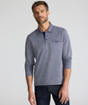 Model is wearing UNTUCKit Textured Cotton Polo in Navy. 