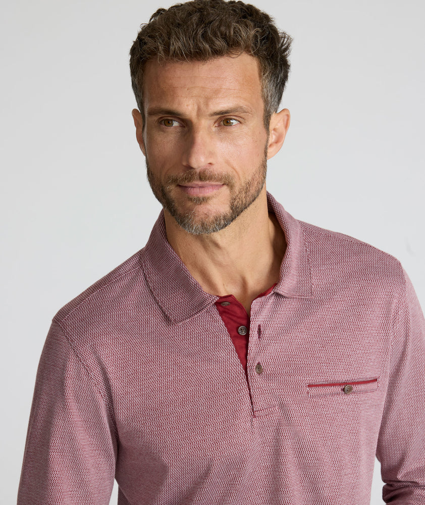 Model is wearing UNTUCKit Textured Cotton Polo in red. 
