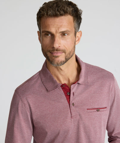 Model is wearing UNTUCKit Textured Cotton Polo in red. 