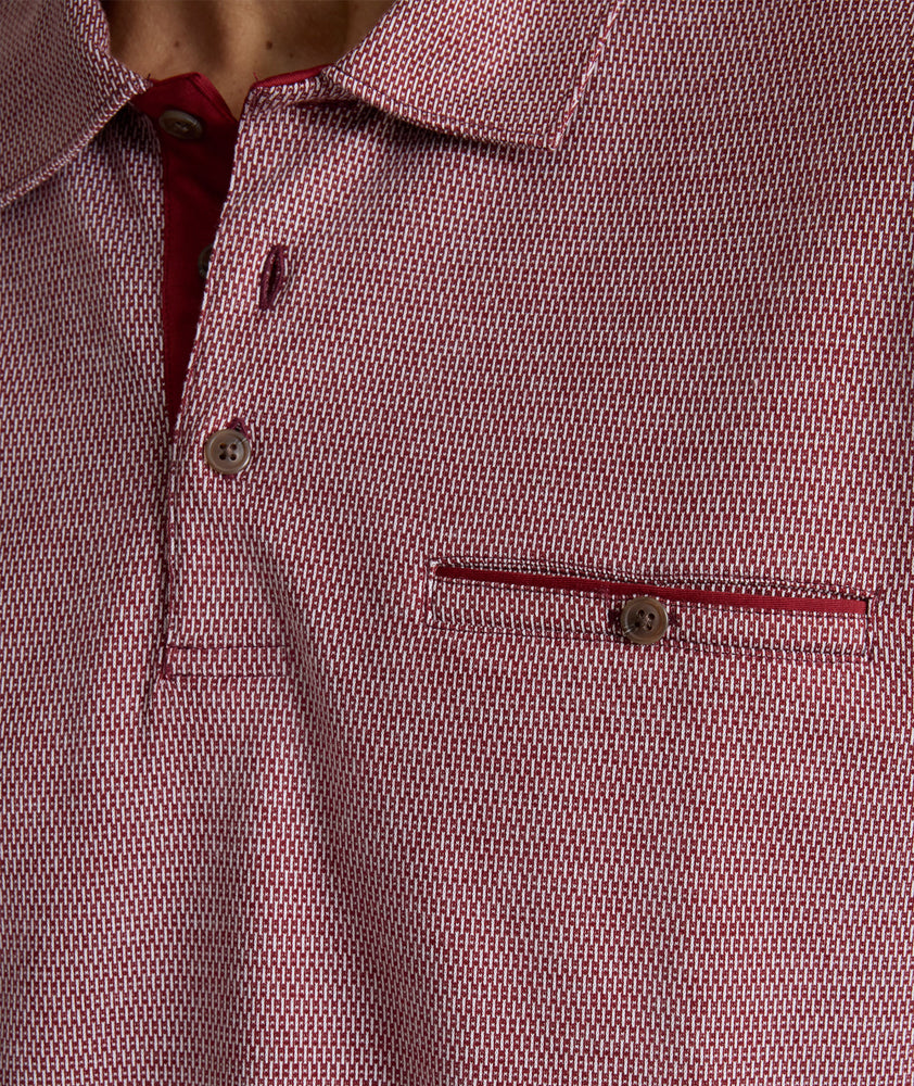 Model is wearing UNTUCKit Textured Cotton Polo in red. 