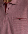 Model is wearing UNTUCKit Textured Cotton Polo in red. 