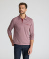 Model is wearing UNTUCKit Textured Cotton Polo in red. 