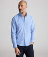 Model is wearing UNTUCKit Almeida perfroamcne shirt. 