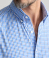 Model is wearing UNTUCKit Almeida perfroamcne shirt. 