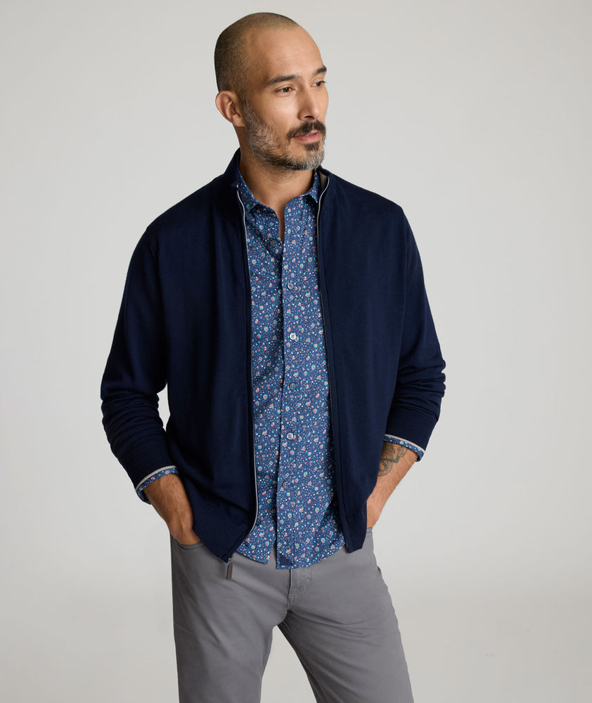 Model is wearing UNTUCKit Alston Full-Zip in Navy.