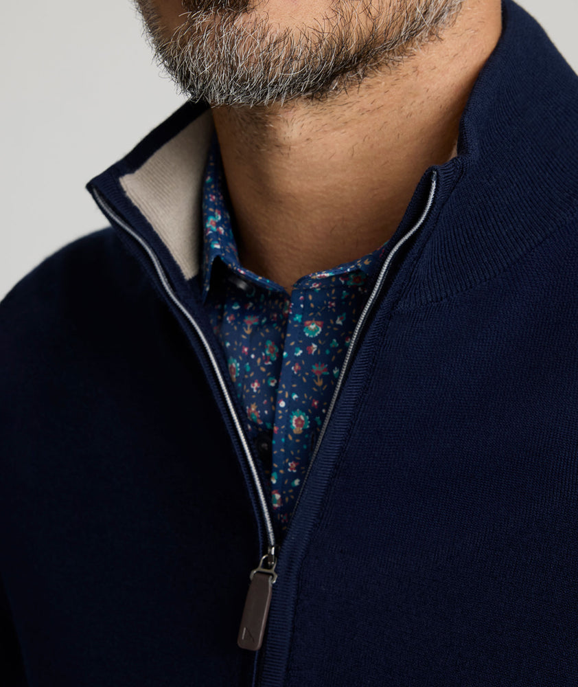 Model is wearing UNTUCKit Alston Full-Zip in Navy.