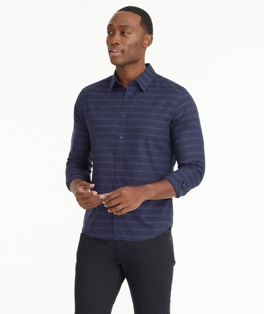 Model is wearing Wrinkle-Free Altesse Shirt in Navy & Black Check.