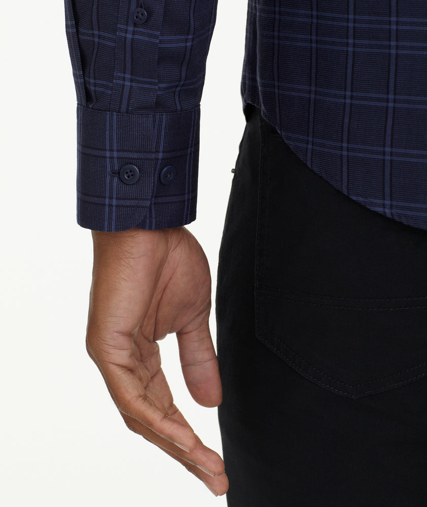 Model is wearing Wrinkle-Free Altesse Shirt in Navy & Black Check.