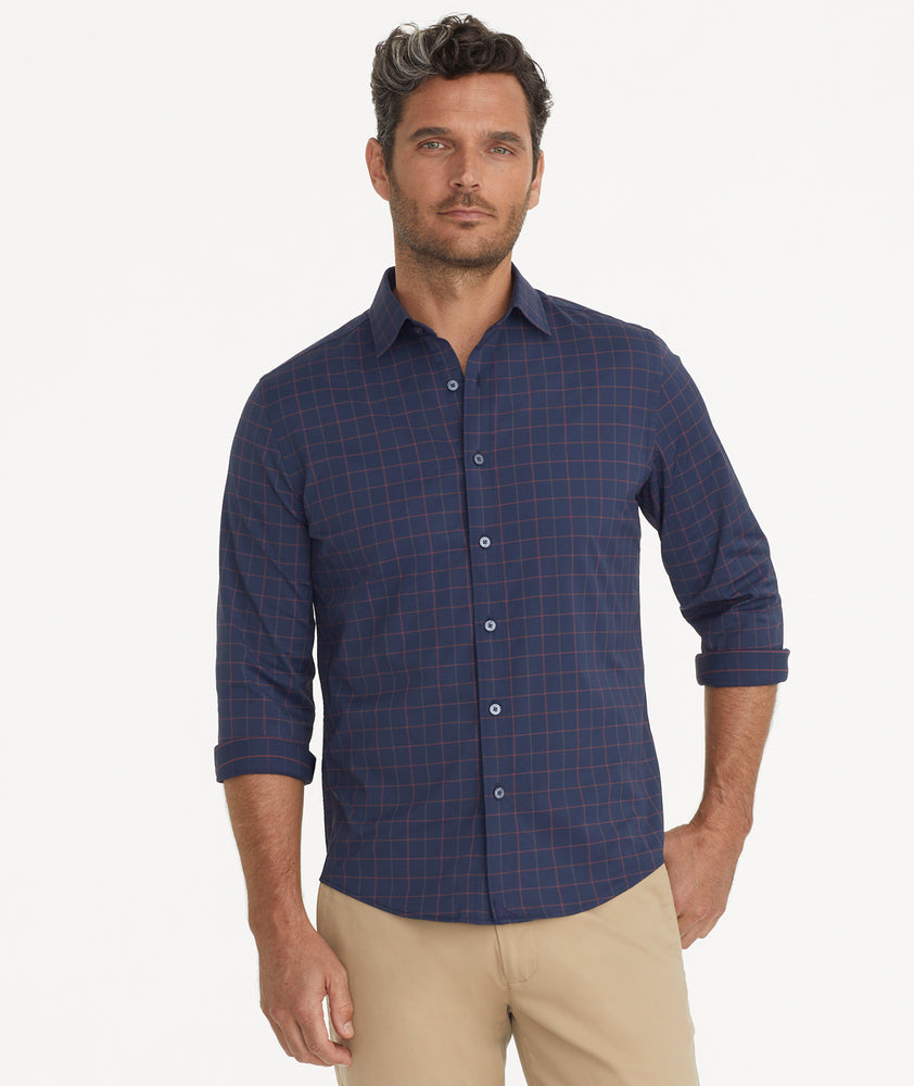 Model is wearing UNTUCKit Wrinkle-Free Performance Altrugo Shirt in Navy Windowpane Check.
