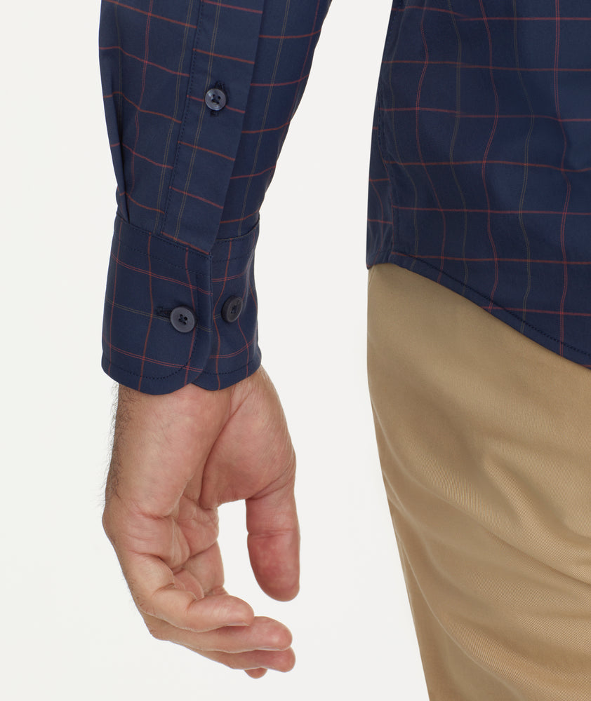 Model is wearing UNTUCKit Wrinkle-Free Performance Altrugo Shirt in Navy Windowpane Check.