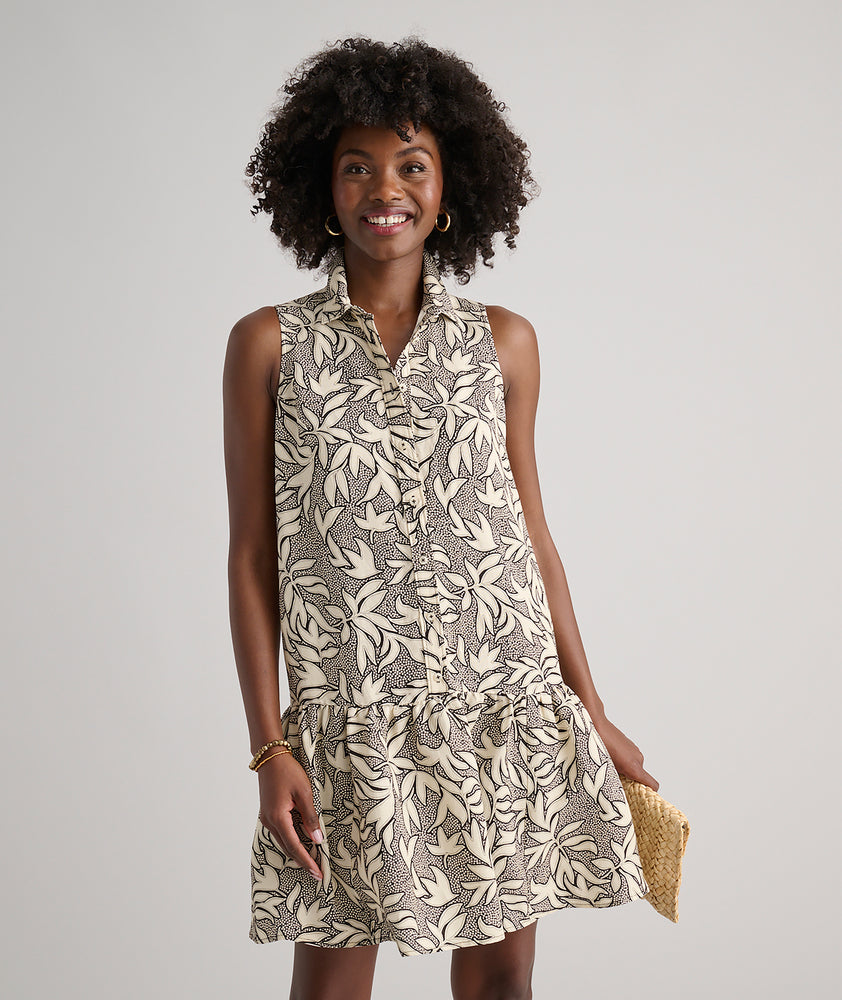Model is wearing UNTUCKit Amara dress in floral tan print.