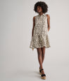 Model is wearing UNTUCKit Amara dress in floral tan print.