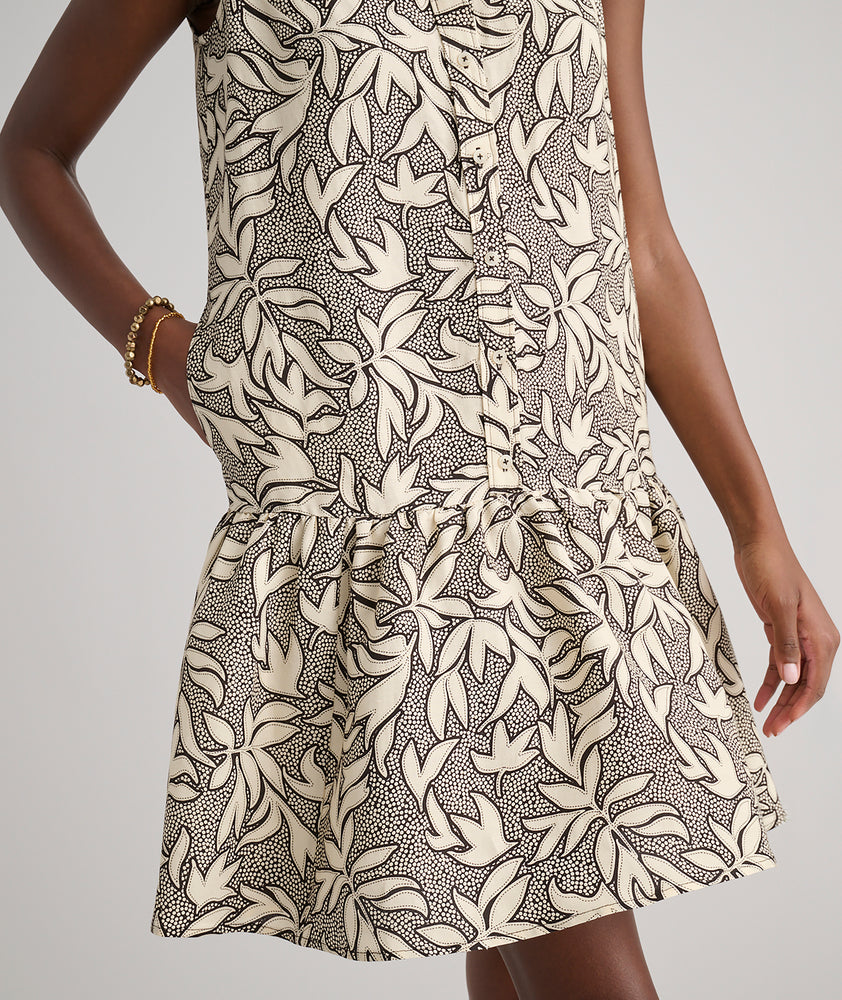 Model is wearing UNTUCKit Amara dress in floral tan print.