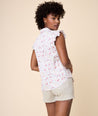Model is wearing UNTUCKit White with Floral Print Anne Shirt.