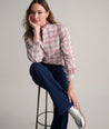 Model is wearing UNTUCKit Antonia plaid shirt. 