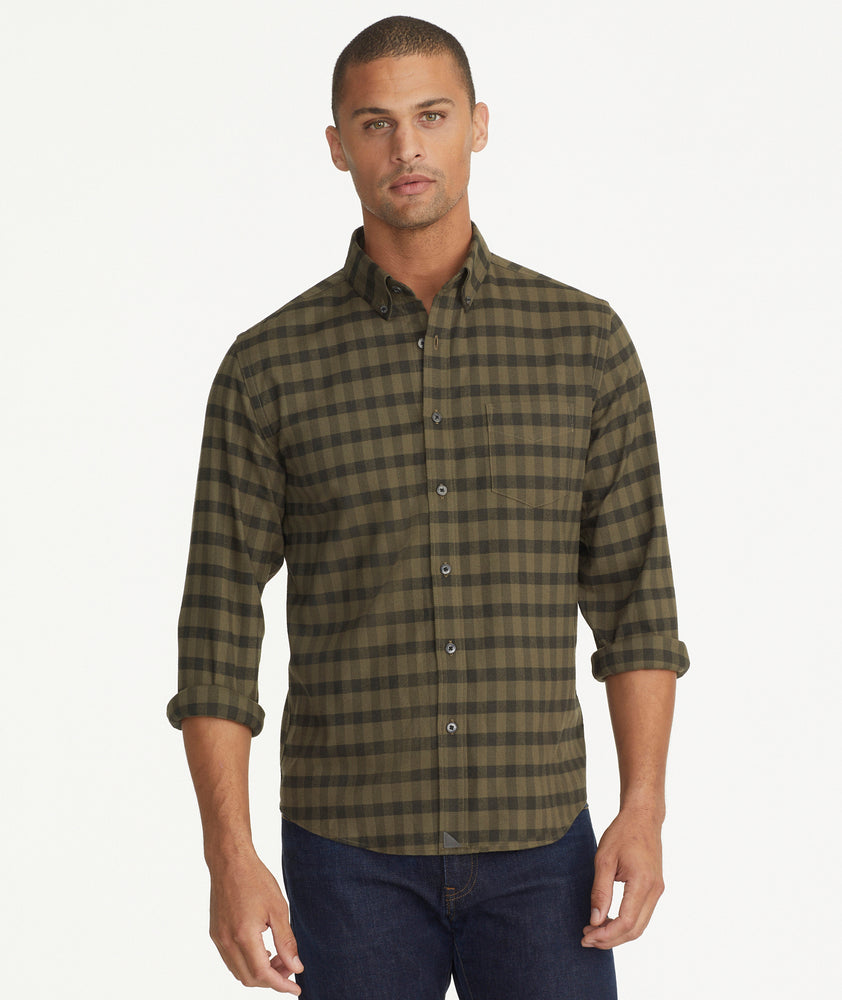 Model is wearing UNTUCKit Wrinkle-Free Performance Flannel Archie Shirt in Forest Green.
