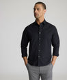 Model is wearing UNTUCKit arden shirt in black. 