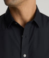 Model is wearing UNTUCKit arden shirt in black. 