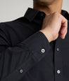 Model is wearing UNTUCKit arden shirt in black. 