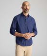 Model wearing a navy UNTUCKit Arnold Shirt.