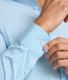 Model is wearing UNTUCKit Ashbourne cottentek shirt in checkered blue. 