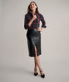 Model is wearing UNTUCKit Aubrey faux leather skirt.