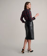 Model is wearing UNTUCKit Aubrey faux leather skirt.