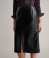 Model is wearing UNTUCKit Aubrey faux leather skirt.