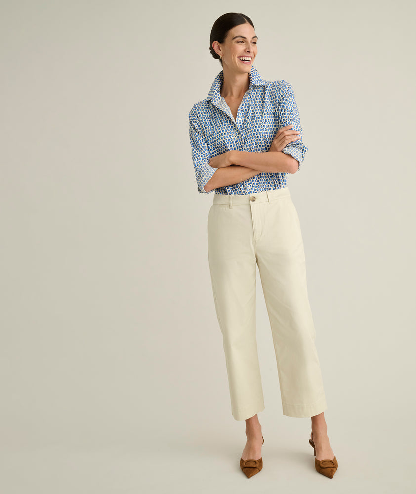 Model is wearing UNTUCKit Ava trousers in tan. 